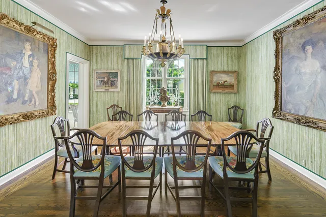 a kitchen with stainless steel appliances granite countertop a sink a stove and a wooden floors