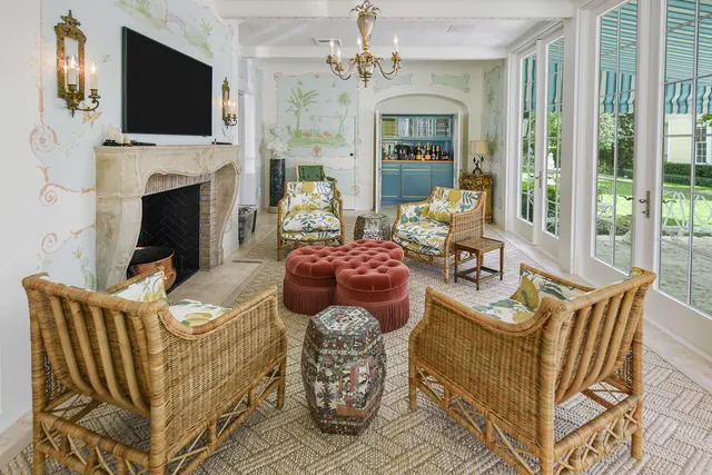 a spacious bedroom with a bed and a chandelier