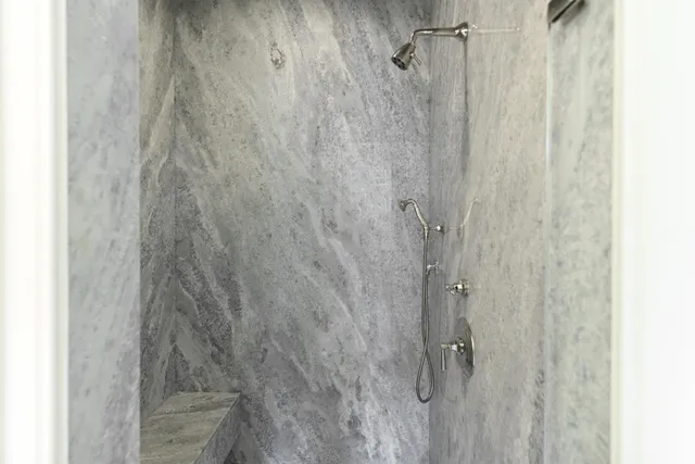 a couple of palm trees in front of yellow house