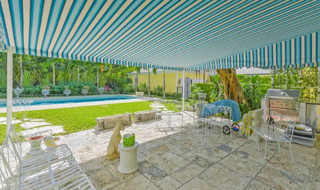 a view of a backyard with garden and plants