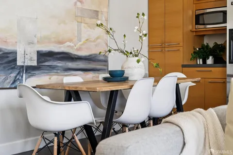 a view of a dining room with furniture and window