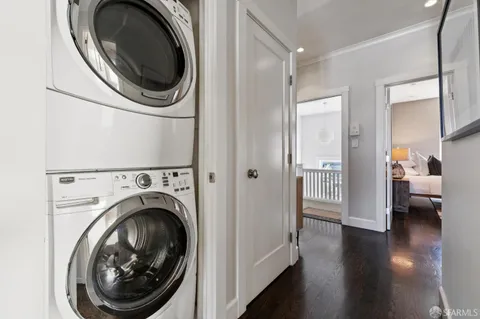 a view of a hallway with washer and dryer