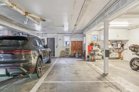 a view of parking garage with cars
