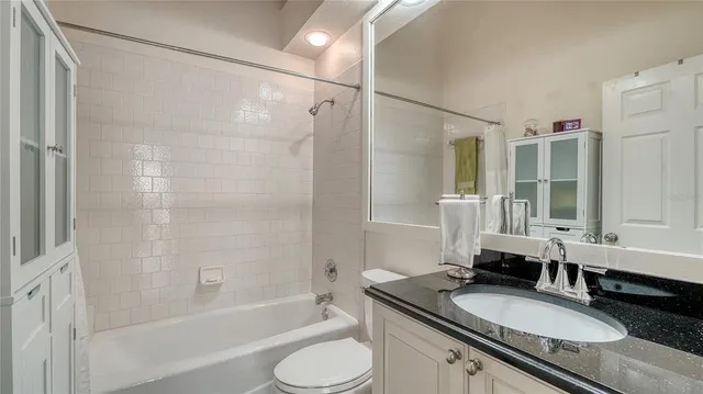 a view of a tennis ground with a small swimming pool