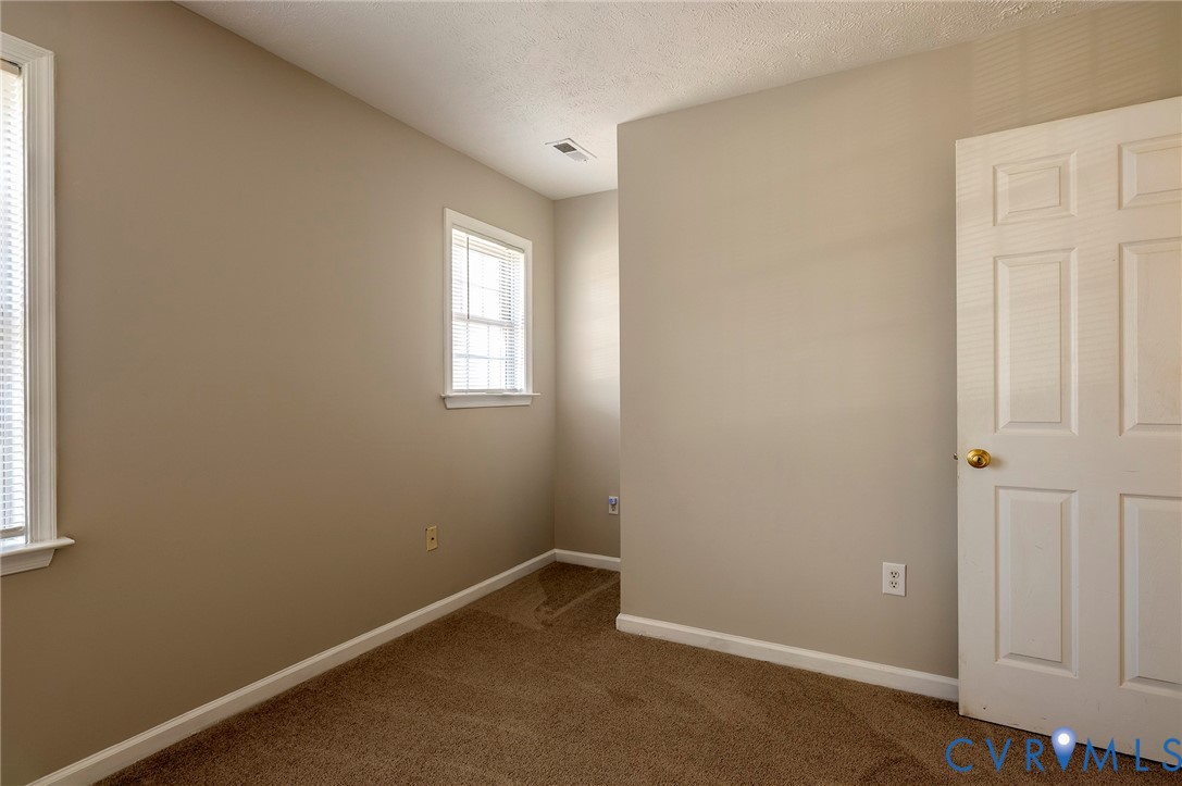 1525 Clarkson Road Richmond, VA 23224 - Photo 11 of 19 an empty room with windows