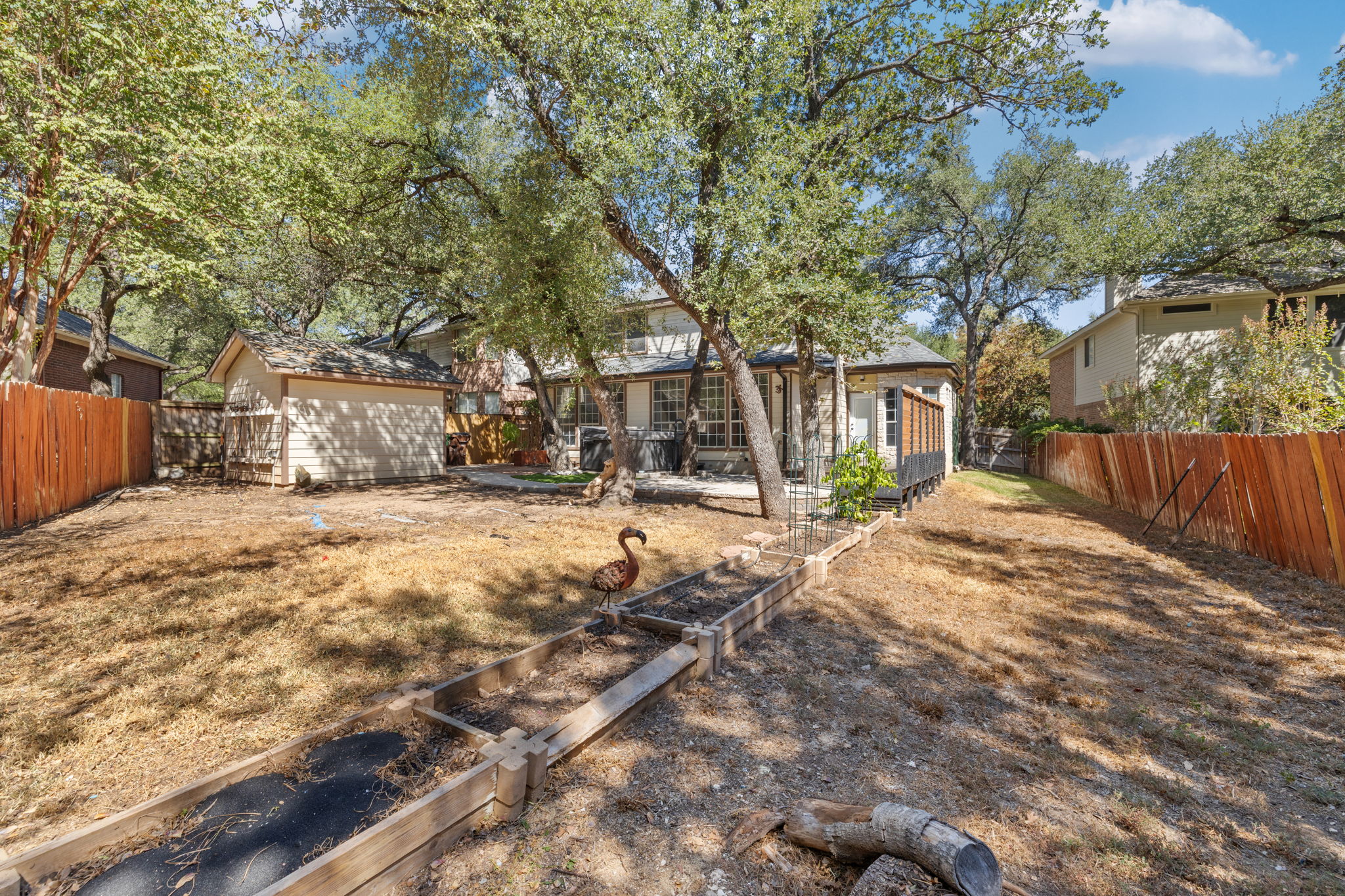 2211 Spring Hollow Path Round Rock, TX 78681 - Photo 35 of 36 Mature shade trees and a spacious yard offer a peaceful outdoor retreat.