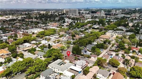 an aerial view of a house with a yard