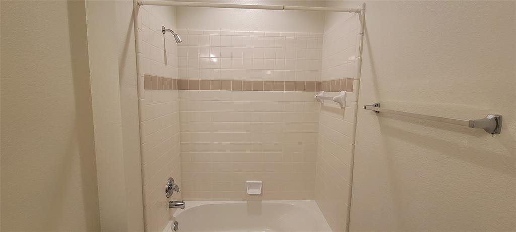 1467 Cattle Baron Court Fairview, TX 75069 - Photo 24 of 32 Full bath featuring shower / tub combo and a textured wall