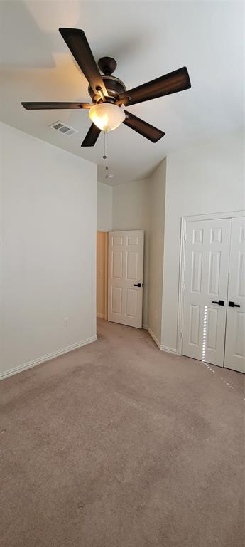 1467 Cattle Baron Court Fairview, TX 75069 - Photo 27 of 32 Unfurnished bedroom featuring carpet flooring, a ceiling fan, and a closet