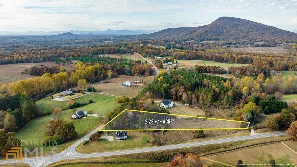 6024 Ransom Free Road Clermont, GA 30527 - Photo 1 of 1 a view of a swimming pool with mountains in the background
