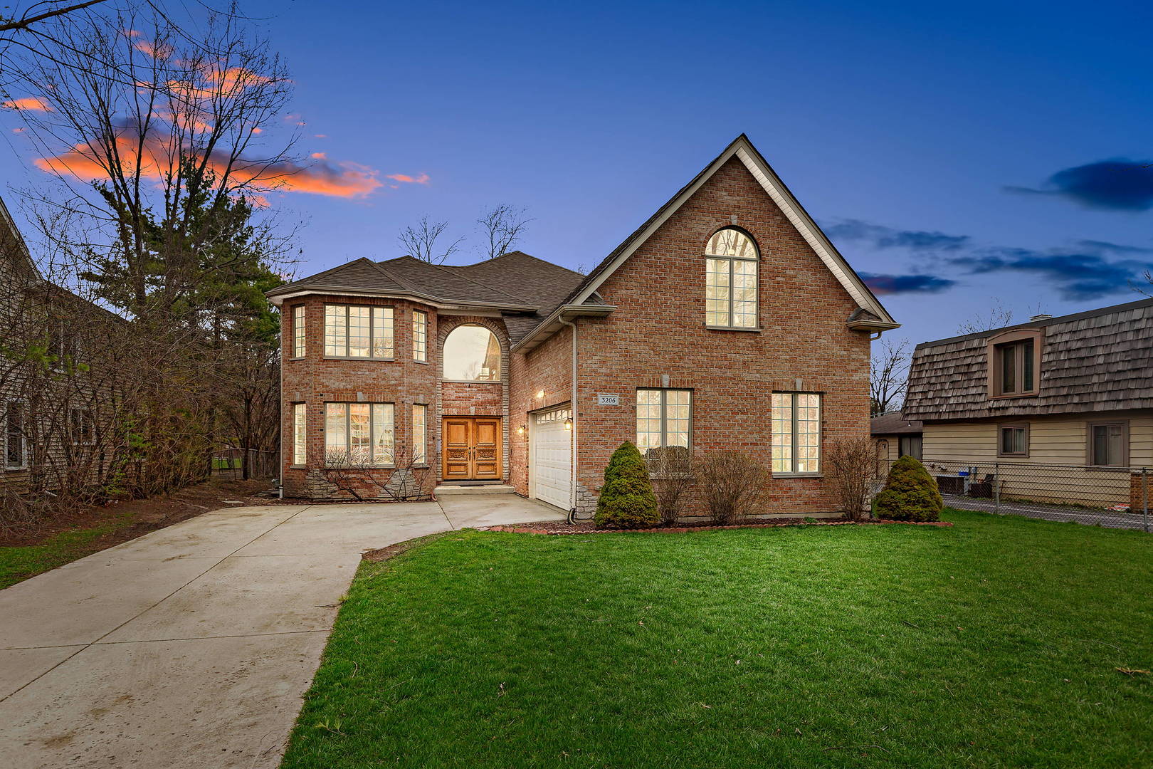 3206 Springdale Avenue Glenview, IL 60025 - Photo 1 of 20 a front view of a house with a yard and trees