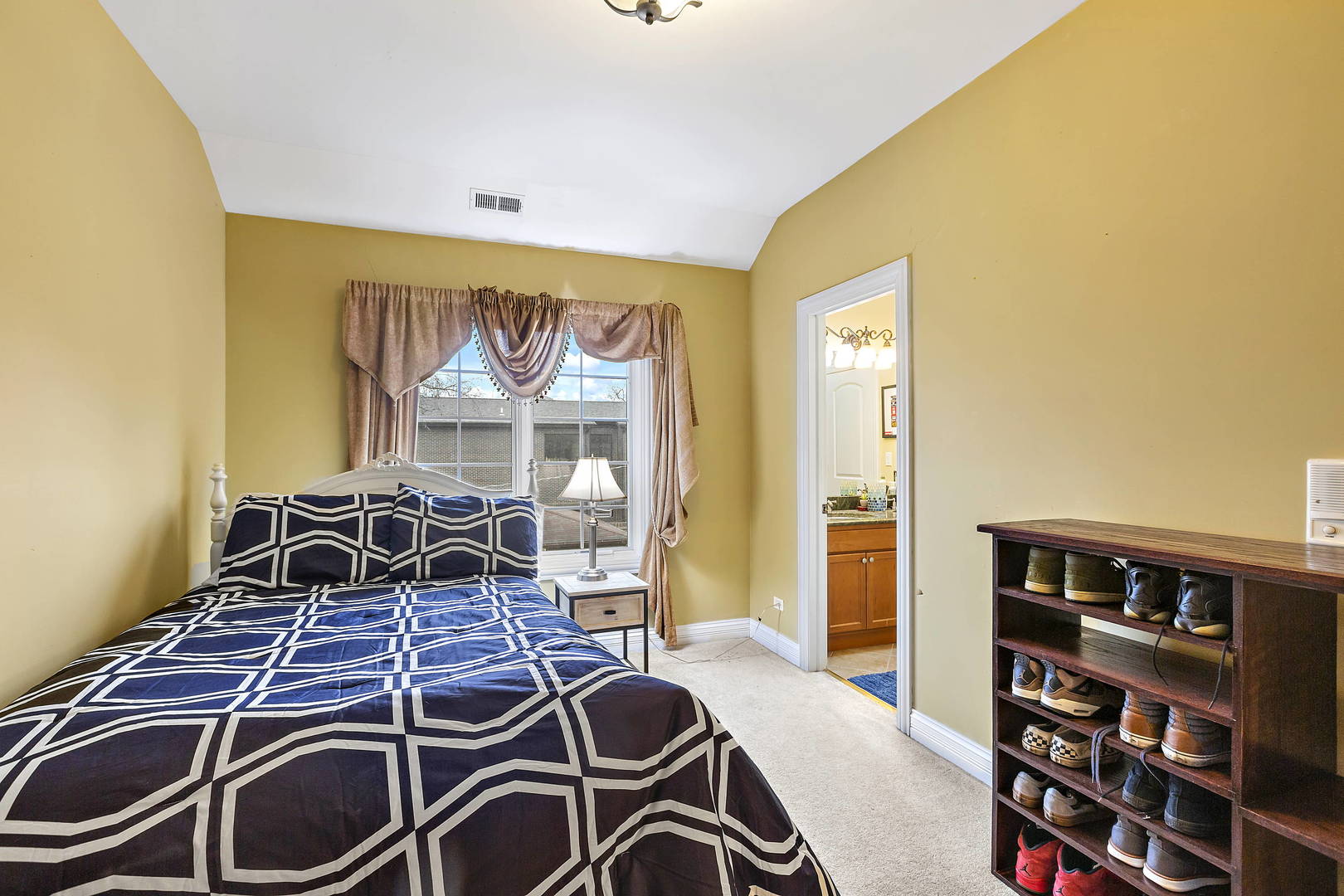 3206 Springdale Avenue Glenview, IL 60025 - Photo 14 of 20 a bedroom with a bed and a book shelf