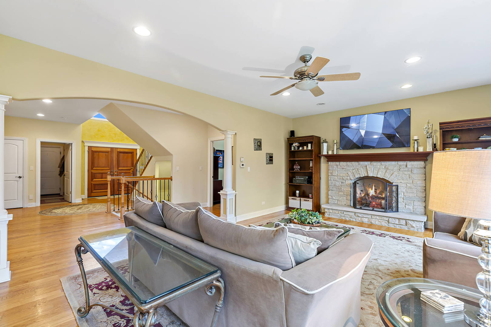 3206 Springdale Avenue Glenview, IL 60025 - Photo 2 of 20 a living room with furniture a fireplace and a flat screen tv