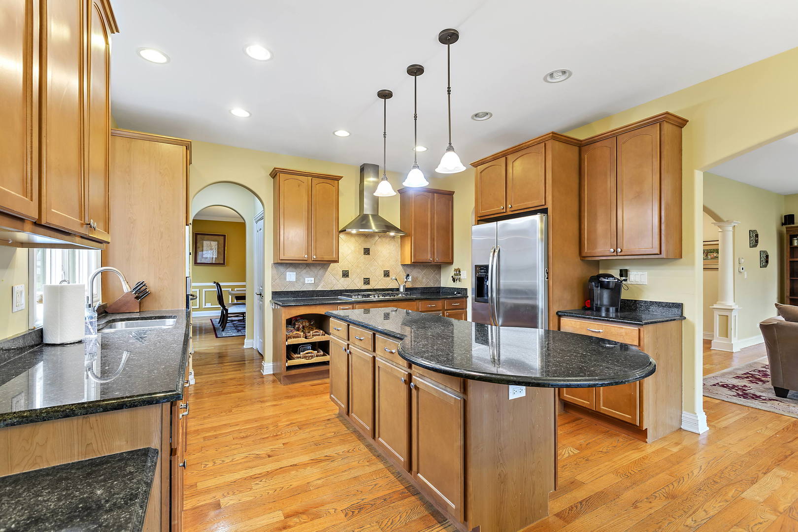 3206 Springdale Avenue Glenview, IL 60025 - Photo 5 of 20 a kitchen with stainless steel appliances granite countertop a stove refrigerator and cabinets