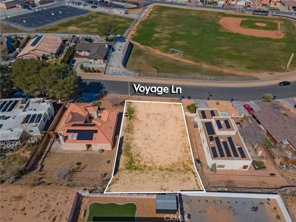 an aerial view of a house with a swimming pool