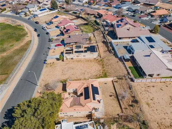 an aerial view of a house with a swimming pool