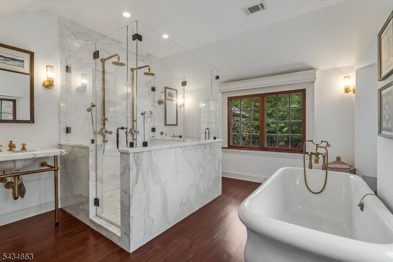 55 State Park Road Chester, NJ 07930 - Photo 23 of 48 a bathroom with a bathtub a sink a mirror and a shower