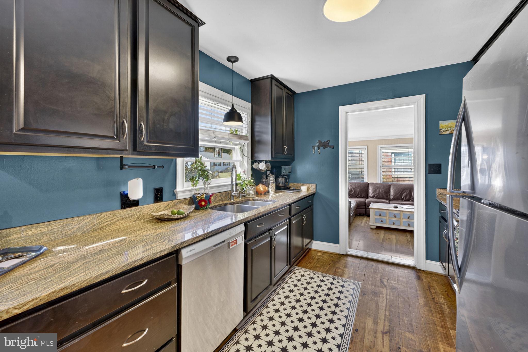 134 Garr Avenue Culpeper, VA 22701 - Photo 11 of 43 a kitchen with stainless steel appliances granite countertop a sink stove and refrigerator