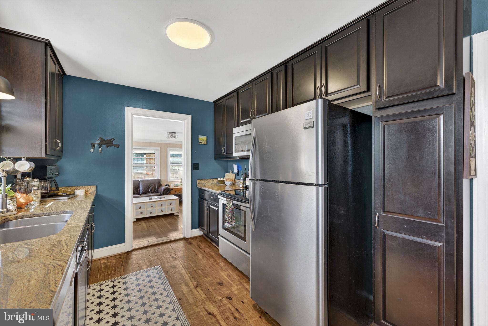 134 Garr Avenue Culpeper, VA 22701 - Photo 12 of 43 a kitchen with stainless steel appliances granite countertop a refrigerator stove and sink