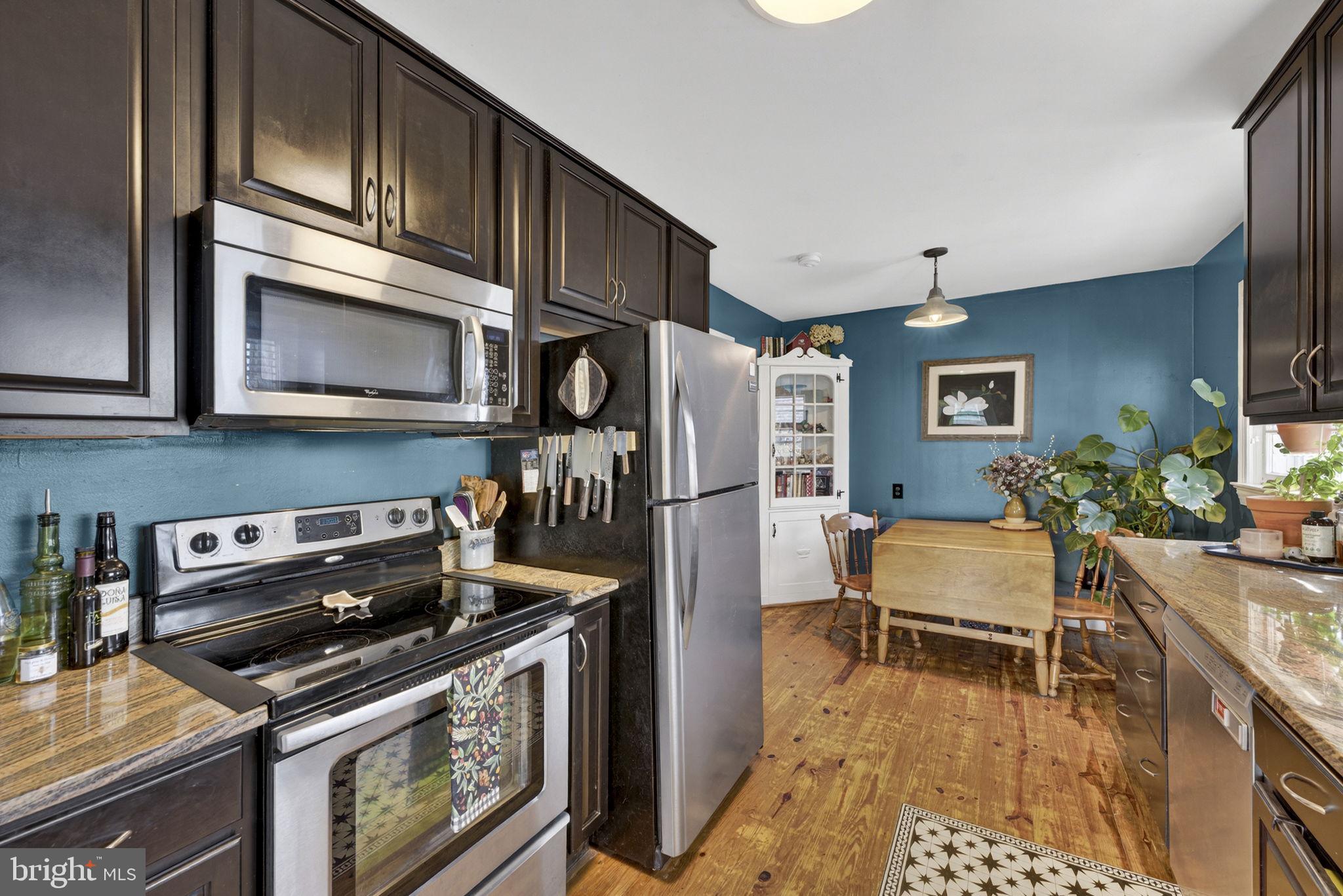 134 Garr Avenue Culpeper, VA 22701 - Photo 13 of 43 a kitchen with stainless steel appliances granite countertop a stove and a refrigerator