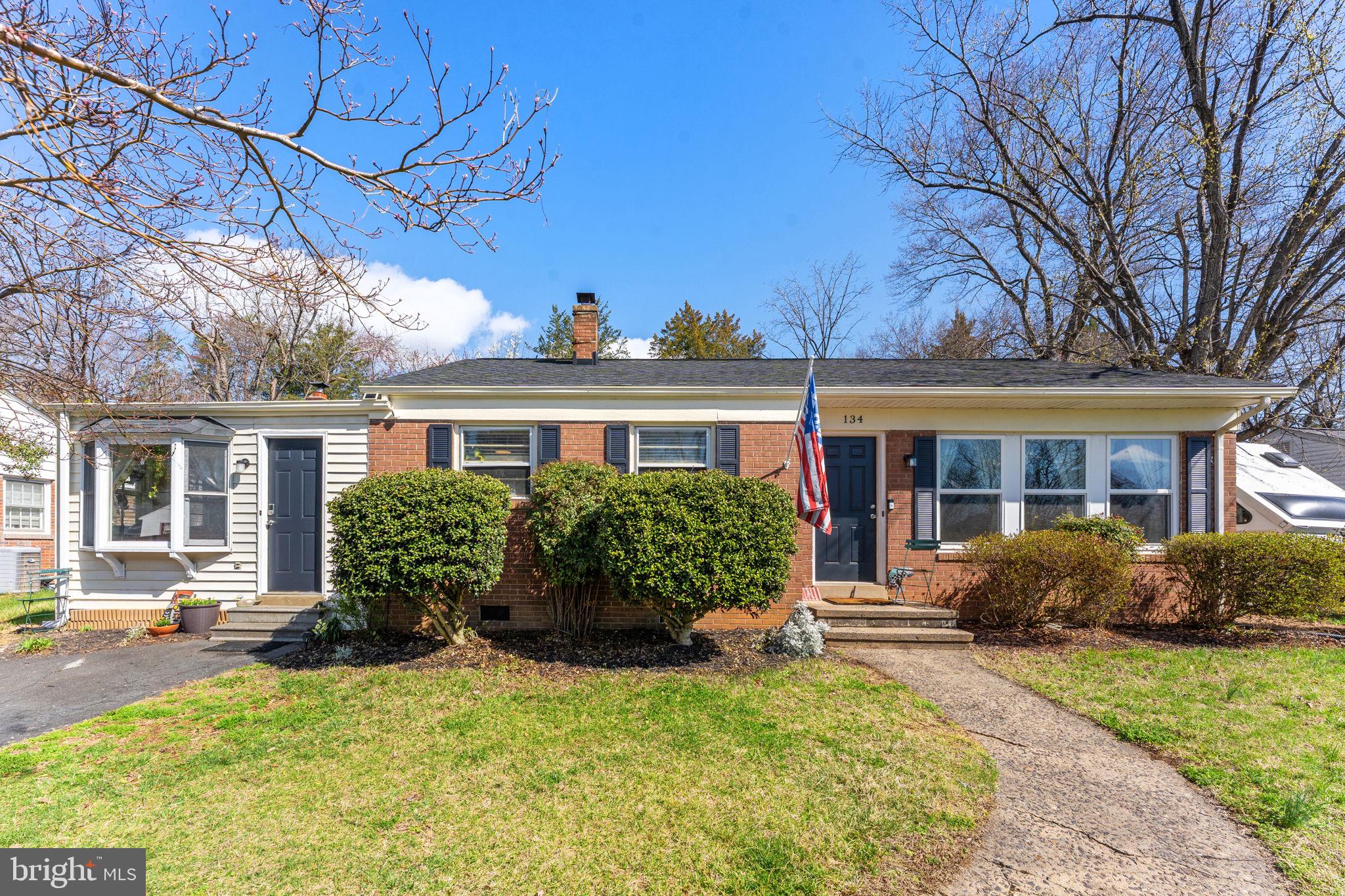 134 Garr Avenue Culpeper, VA 22701 - Photo 2 of 43 a front view of a house with garden and plants