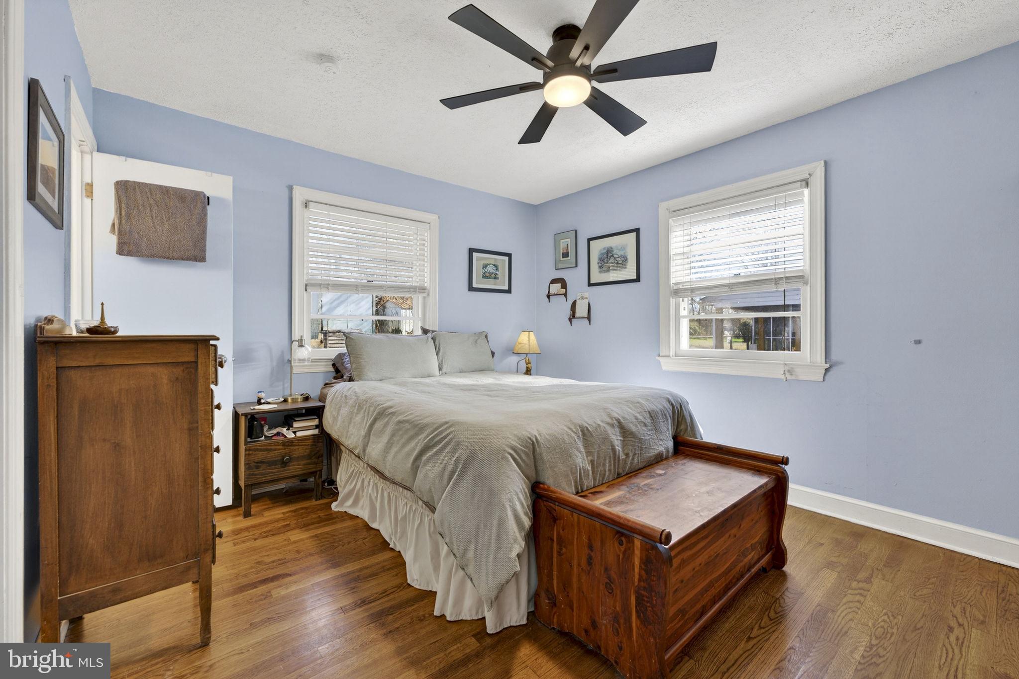 134 Garr Avenue Culpeper, VA 22701 - Photo 22 of 43 a bedroom with a large bed a chandelier and a window