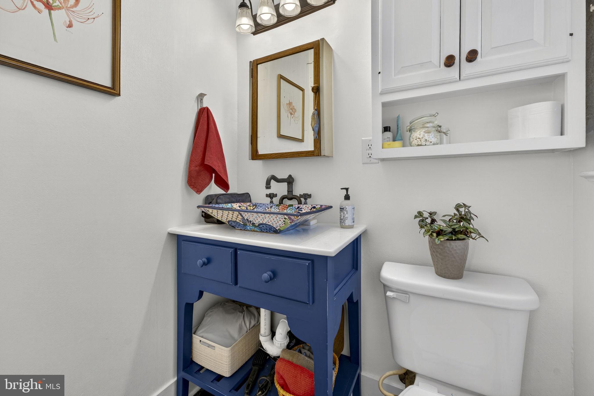 134 Garr Avenue Culpeper, VA 22701 - Photo 25 of 43 a bathroom with a toilet sink and mirror