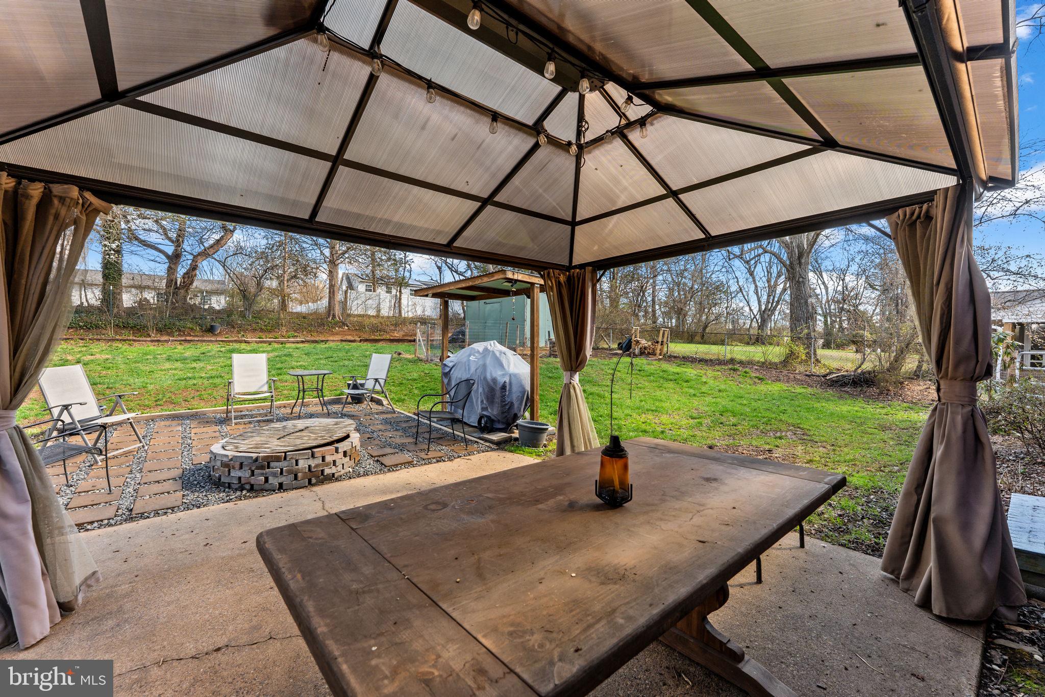 134 Garr Avenue Culpeper, VA 22701 - Photo 34 of 43 a view of a patio with a table chairs and a backyard