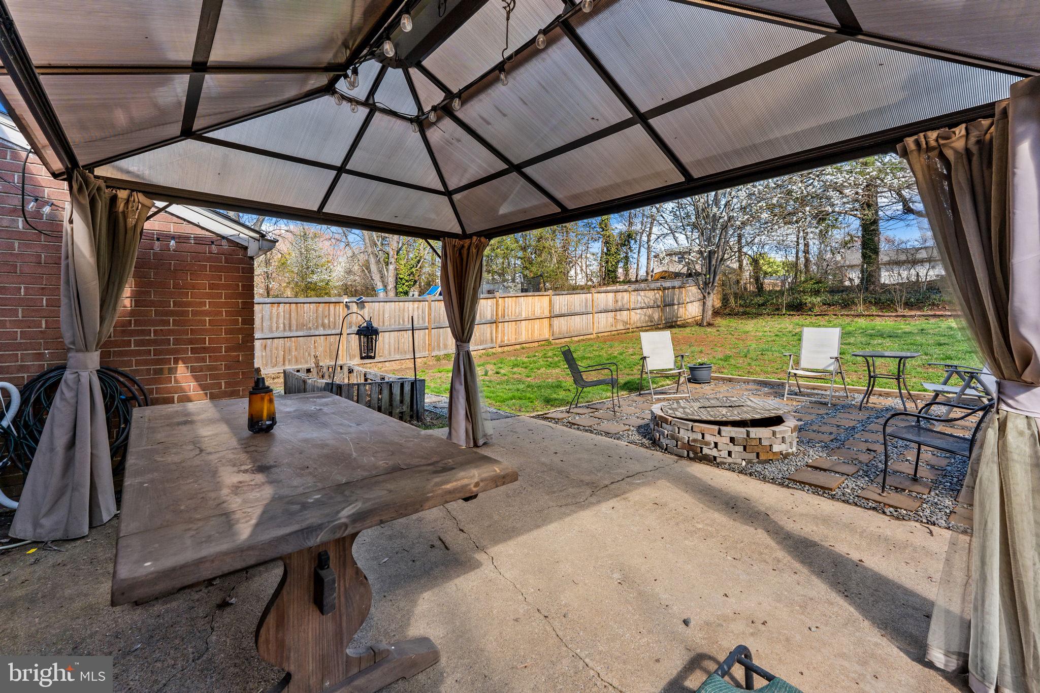 134 Garr Avenue Culpeper, VA 22701 - Photo 35 of 43 a view of a patio with a table chairs and a umbrella