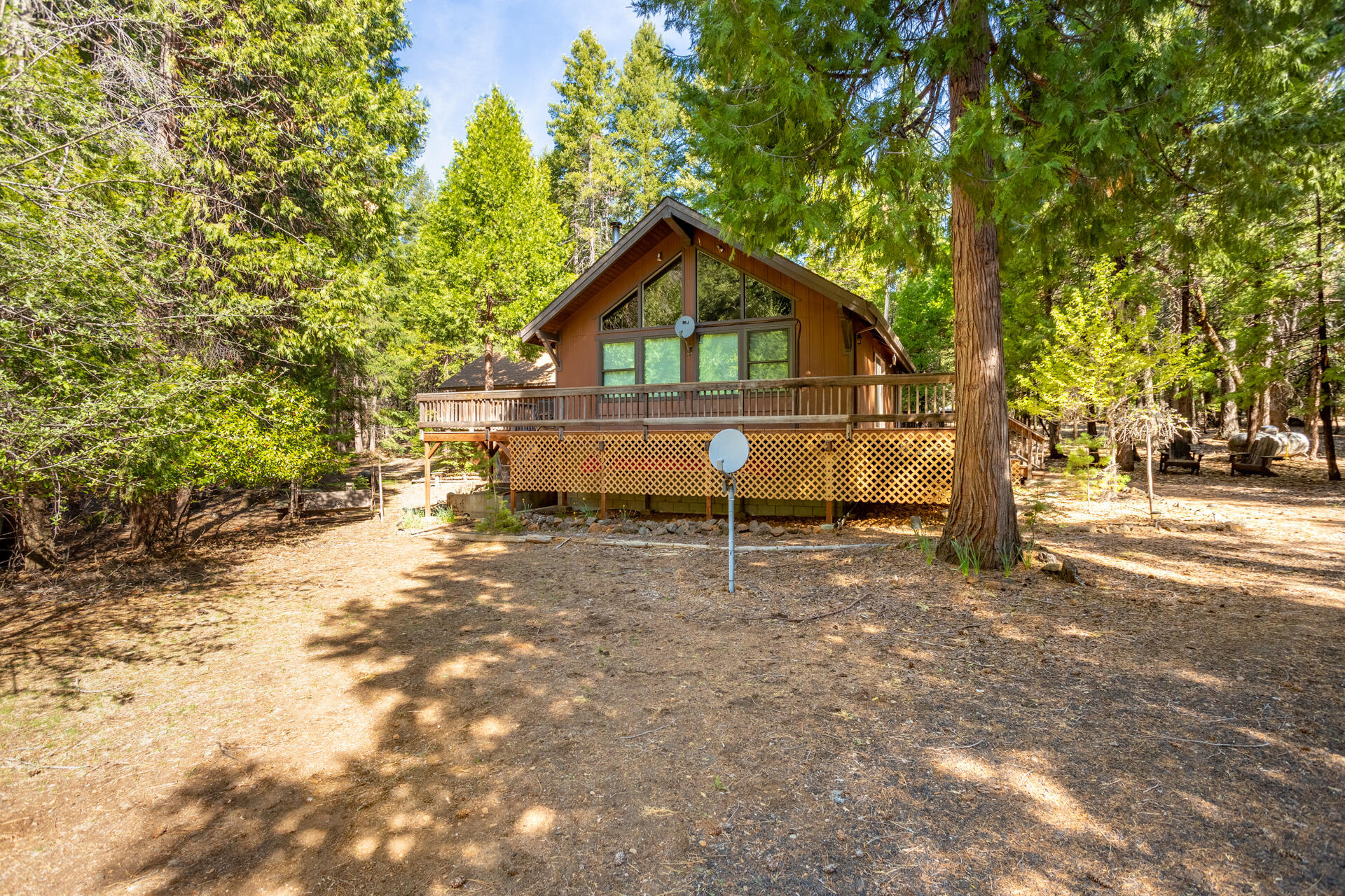 a view of a house with a tree in the background