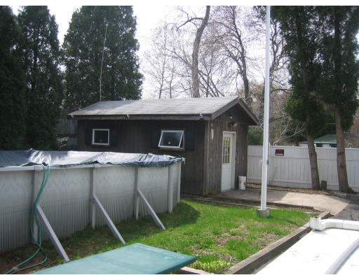 28 Eustis Street Saugus, MA 01906 - Photo 9 of 9 a view of a patio with table and chairs with wooden fence and large trees