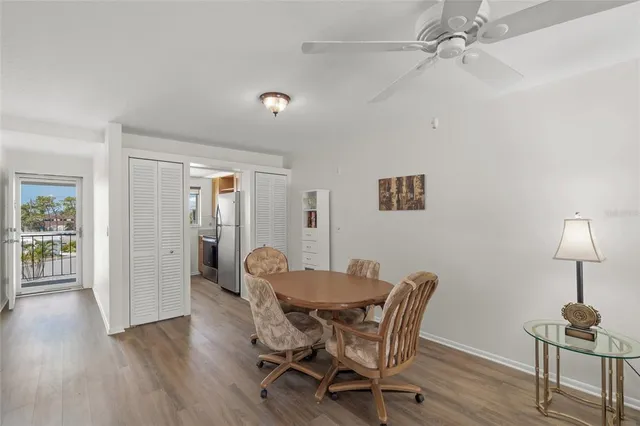 a view of a dining room with furniture and wooden floor