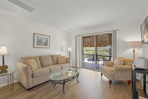 a living room with furniture and a large window