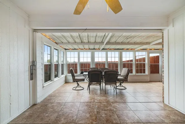 a dining room with furniture and chandelier