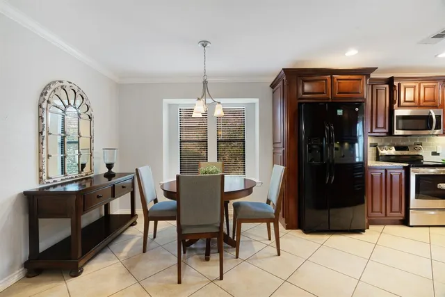 a dining room with furniture and window
