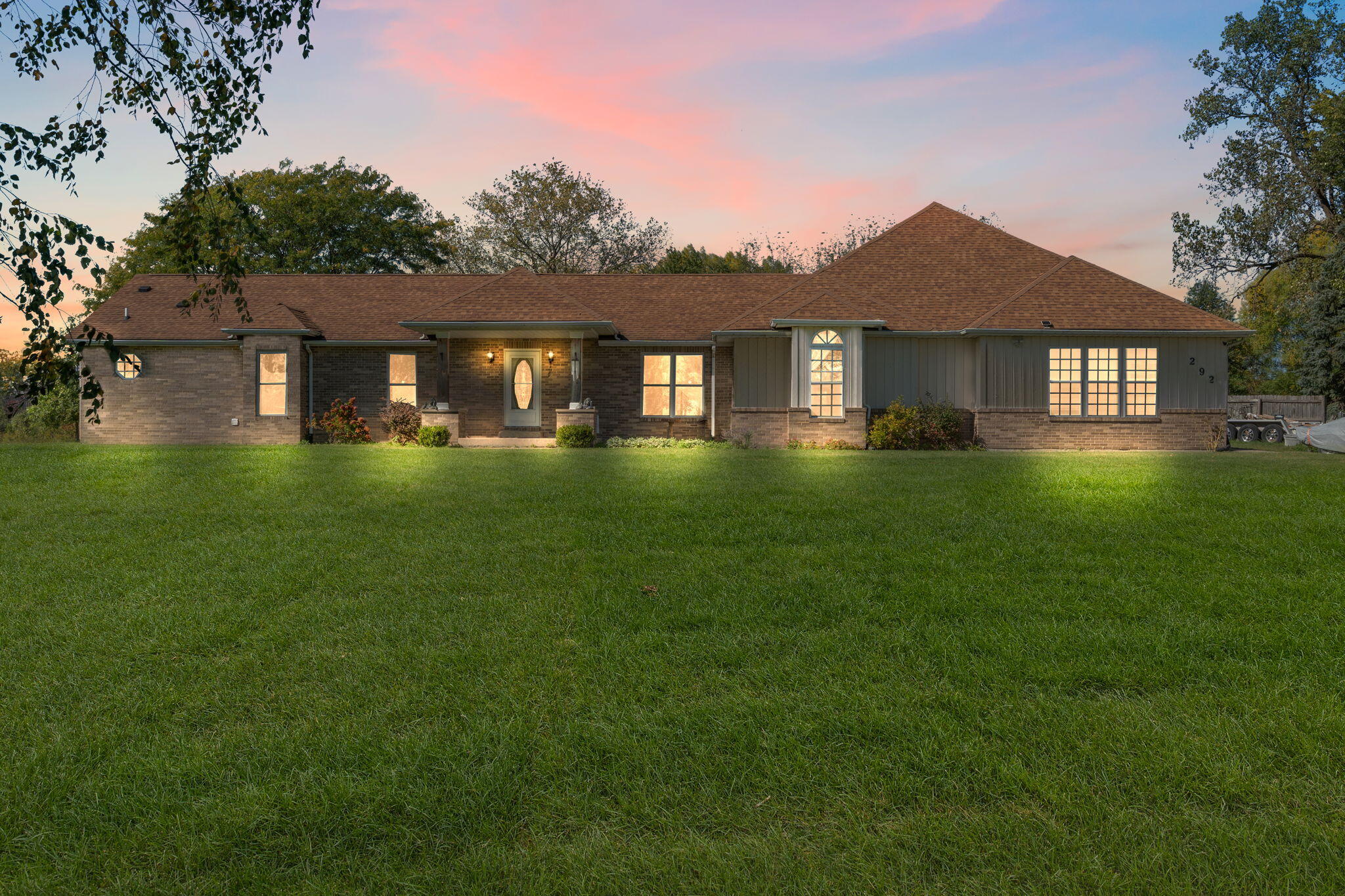 a front view of a house with a yard