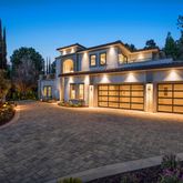 a front view of a house with parking space