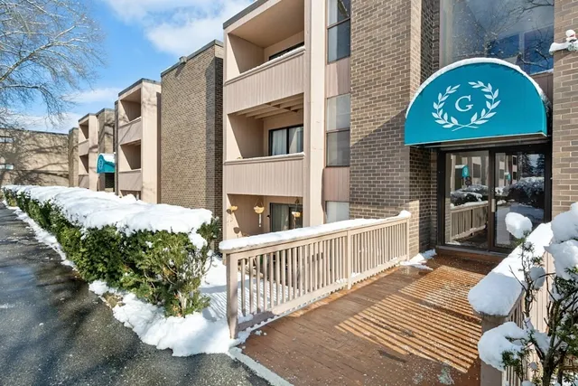 a view of a wooden house with a bench