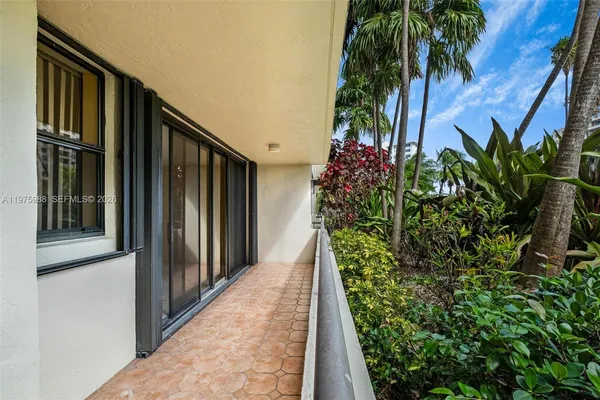 a view of balcony with furniture