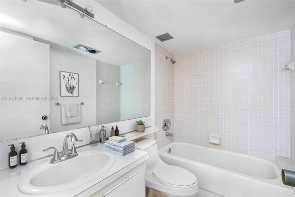 a bathroom with a sink toilet and a bathtub