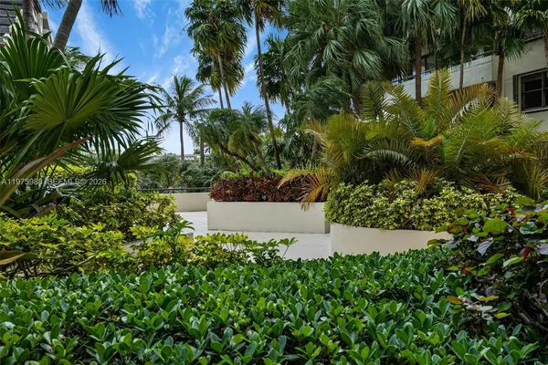 a view of a garden with a fountain