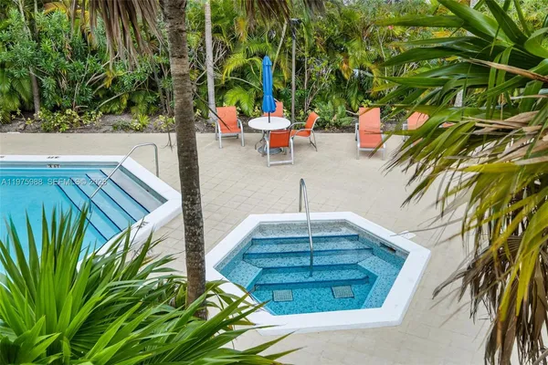 a view of a chairs and table in the patio