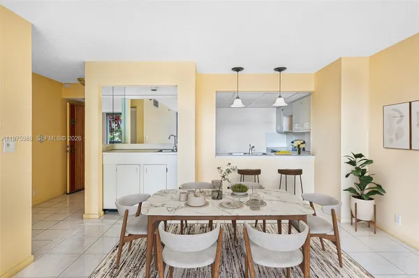 a bathroom with a bathtub a sink and a mirror