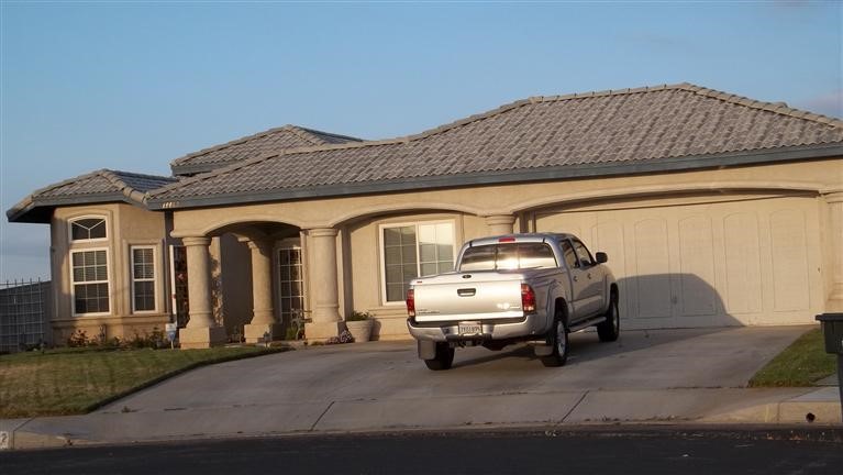 14462 Via Roca Victorville, CA 92392 - Photo 1 of 1 a car parked in front of a house