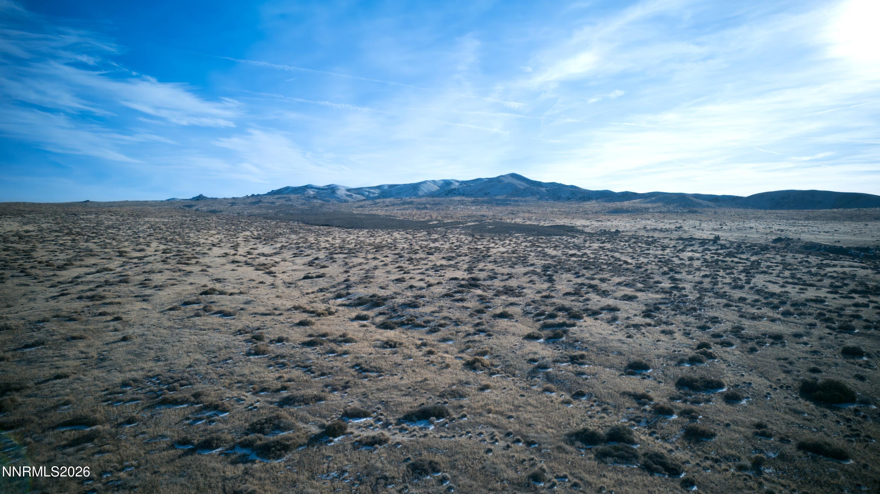 0 Poker Brown Camp Road Lovelock, NV 89419 - Photo 3 of 11 a view of a large body of water with a mountain in the background