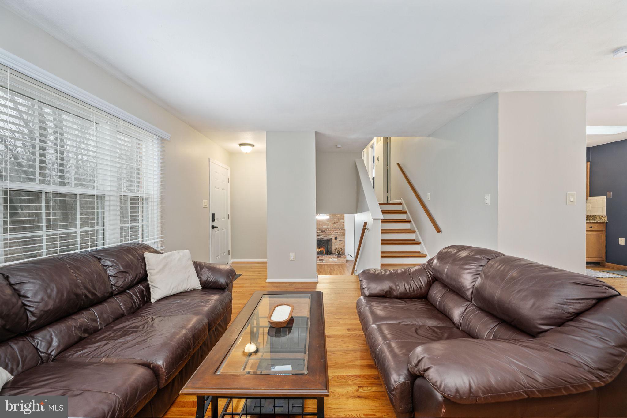 6765 Settlers Ridge Road Warrenton, VA 20187 - Photo 12 of 66 a living room with furniture and a large window