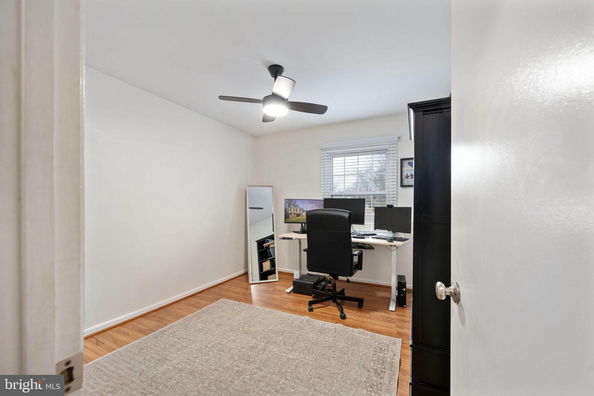 6765 Settlers Ridge Road Warrenton, VA 20187 - Photo 22 of 66 a view of a workspace with furniture and a window