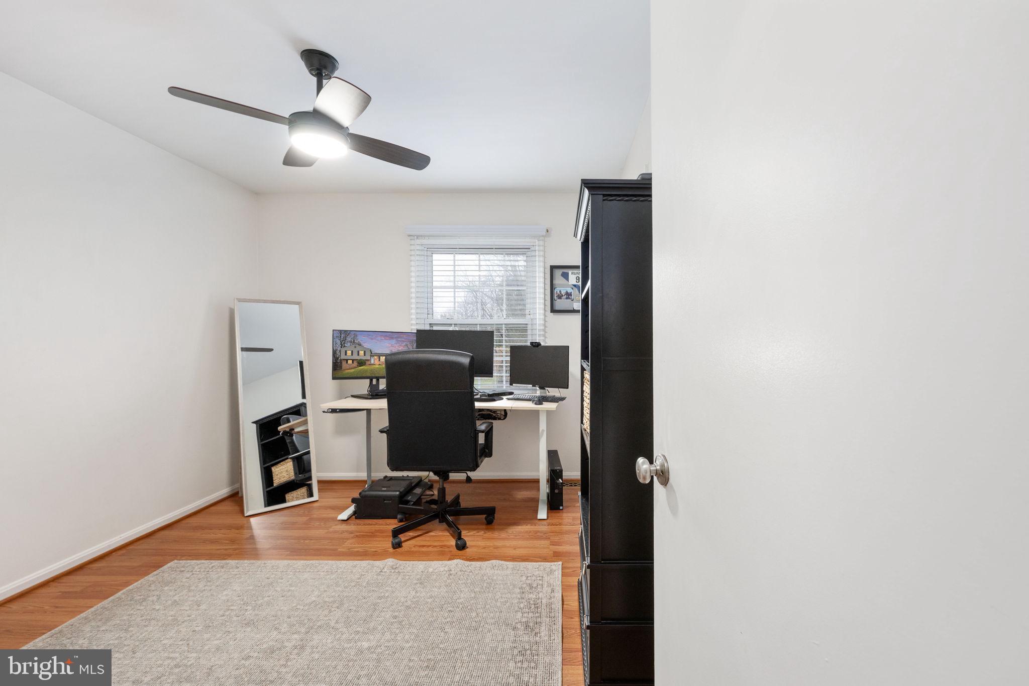6765 Settlers Ridge Road Warrenton, VA 20187 - Photo 23 of 66 a view of a workspace with furniture and a window
