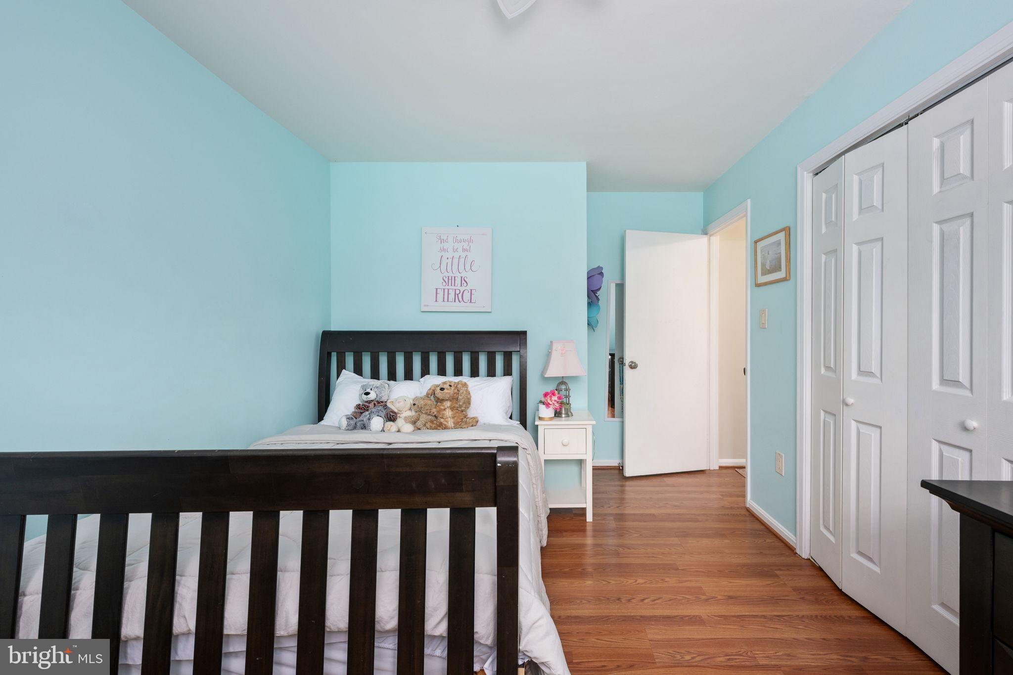 6765 Settlers Ridge Road Warrenton, VA 20187 - Photo 26 of 66 a bedroom with furniture and wooden floor
