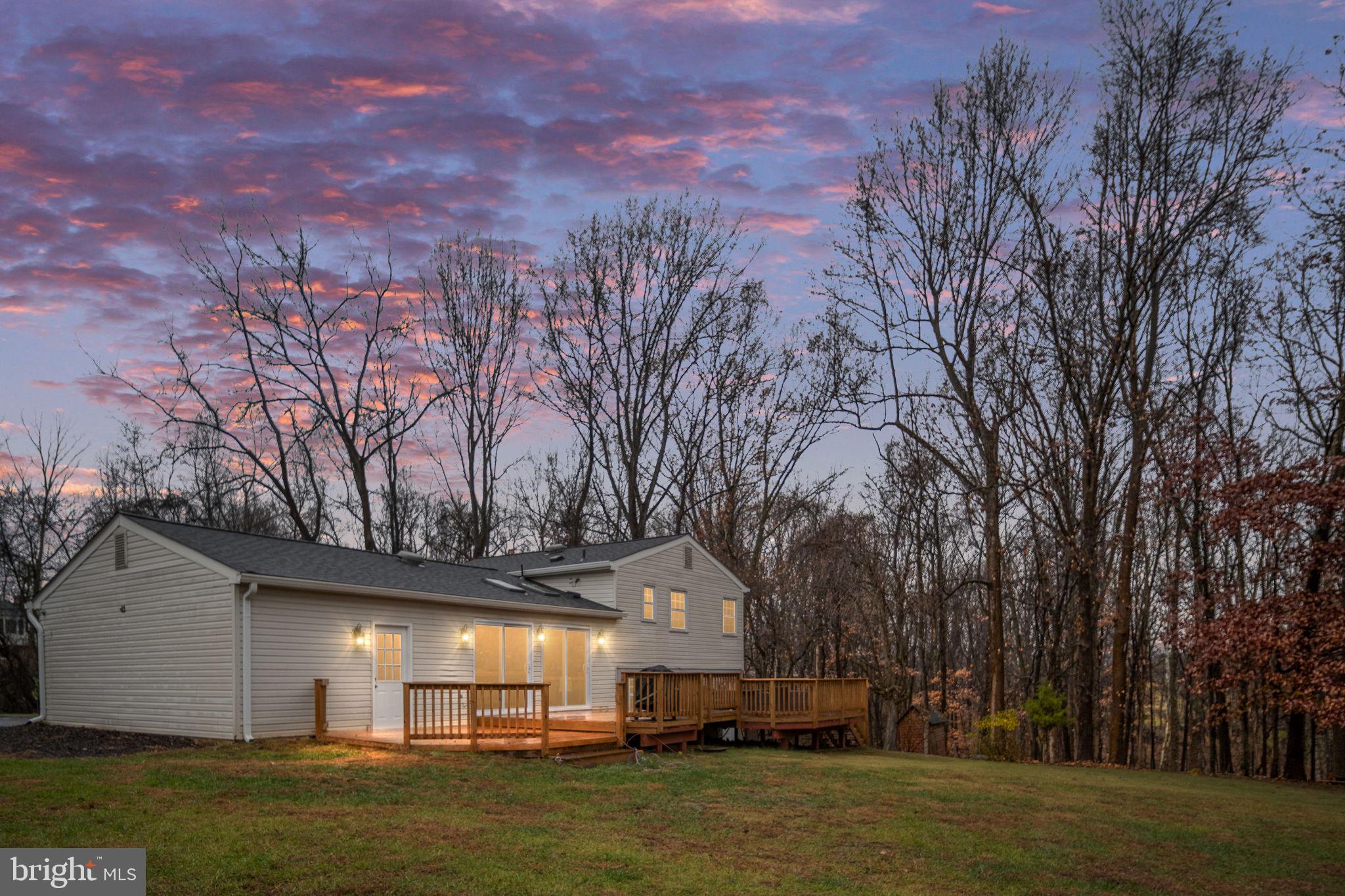 6765 Settlers Ridge Road Warrenton, VA 20187 - Photo 3 of 66 a front view of house with yard and trees